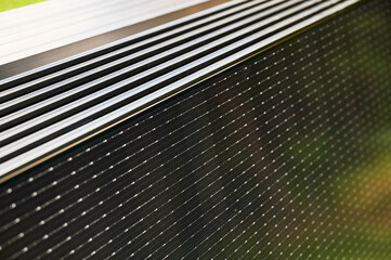 Close-up new solar panels ready for installation. Renewable energy technology, green living, and the implementation of solar power in residential areas.