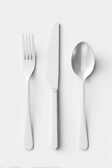 A minimalist overhead shot of a fork, knife, and spoon, gleaming metallic, arranged vertically on a plain white background