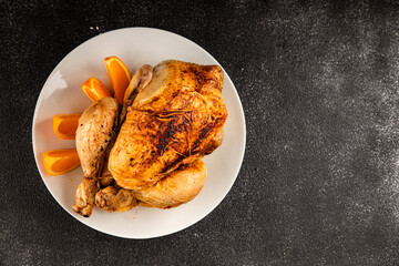 Baked chicken with oranges whole grilled chicken christmas holiday dish new year natural product tasty snack fresh delicious gourmet food background on the table rustic top view copy space
