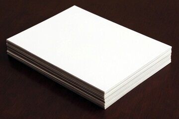 Stack of blank white paper sheets on dark wood