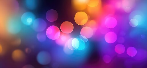 Obraz premium Abstract bokeh background with vibrant, out-of-focus circular lights in shades of blue, pink, orange, and purple, creating a dynamic and colorful visual effect