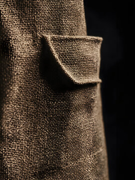 Brown chemical resistant work apron pocket in close up