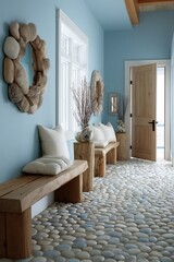 A light-blue hallway with natural wooden benches and a pebble floor, showcasing a peaceful and relaxing atmosphere.