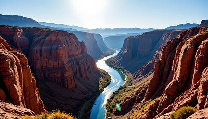 A picturesque natural landscape featuring a vast canyon with towering red rock formations