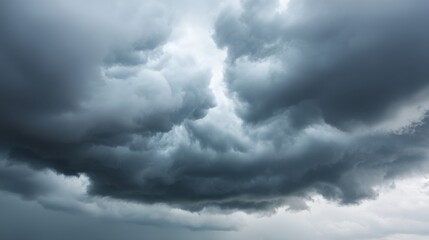 Obraz premium Dark and Ominous Clouds Gathering in the Sky Just Before a Storm with an Eerie Atmospheric Appeal for Nature and Weather Themes