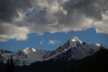 Snow capped peaks at sunset seen from Leh, India.