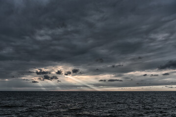 Cloudy Sky over the Baltic Sea in Latvia. Europe. Beautiful Evening Sunlight ever the Water.