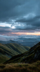 Mountain landscape cloud sky sunrise grass hill nature dramatic outdoor scenery with rolling green hills dramatic clouds and soft sunrise light creating peaceful and awe inspiring atmosphere