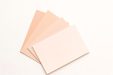 Pastel Colored Blank Paper Sheets Arranged on White Background