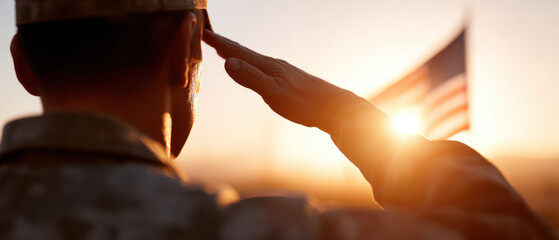 A soldier saluting with the American flag in the background during sunset, symbolizing patriotism and service.