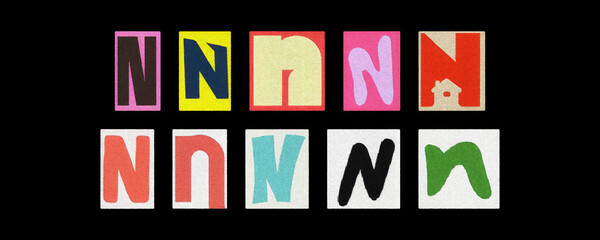 Assorted letter N typography styles, paper cutouts on black background
