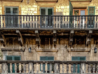 A captivating view of a charming rustic balcony showcasing beautifully weathered wood and vibrant...