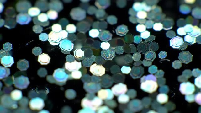 Shimmering Hexagon Glitter Particles Floating on Black Background Video