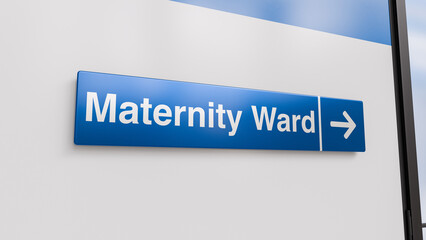 A Blue Maternity Ward Sign With an Arrow in a Hospital Corridor