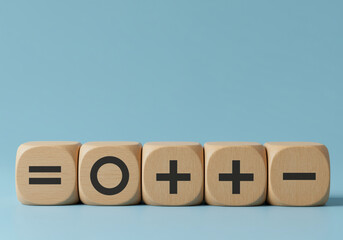 Wooden blocks displaying mathematics symbols on a light blue background simple concept