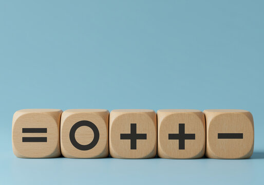 Wooden blocks displaying mathematics symbols on a light blue background simple concept