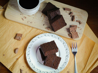 A slice of chocolate cake with chocolate icing