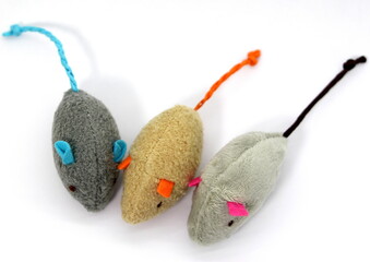 Three very cute soft mice toys for a cat isolated on white background. Top view