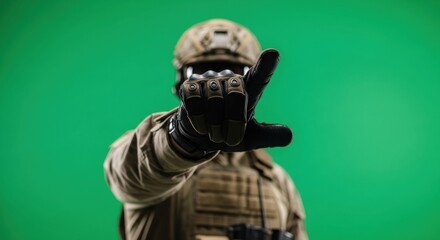 Soldier man in tactical gear pointing or pressing on virtual screen on green screen. Military and technology concept. Chromakey background.