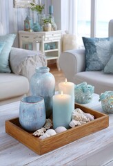 A light-blue and white d?cor arrangement on a wooden tray, showcasing coastal-inspired accents.