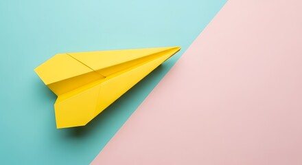 A bright yellow paper airplane is set against a split background of teal and pink, symbolizing travel and imagination