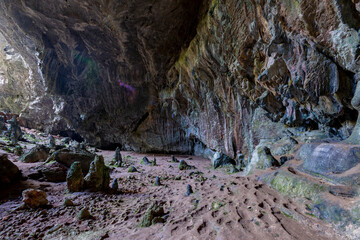 Nimara cave near Marmaris, Turkey inside. Stalactites stalagmites and streak formations in cave of Nimara Magarasi, Turkey. Stone walls and rocks in natural cave. stones covered with moss