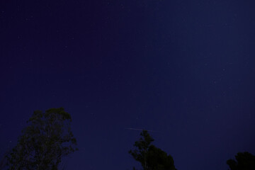 Night sky with shooting star meteor