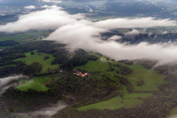 An aerial view of low cloud over the rural landscape near Zurich, Switzerland