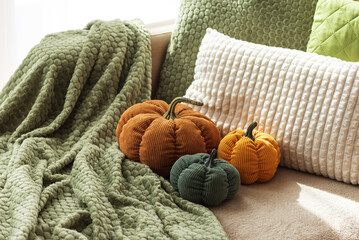 Cozy Autumn Sofa with Fabric Pumpkins and Textured Pillows