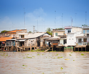 JAN 28 2014 - MY THO, VIETNAM - Houses by a river, on JAN  28, 2014, in  Mekong Delta, Vietnam