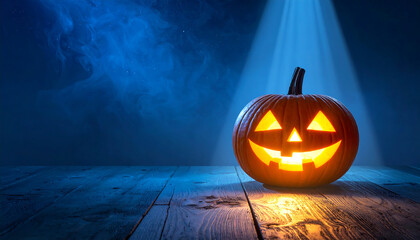 "Glowing jack-o'-lantern on a wooden surface under a spotlight—set against a misty blue background, evoking spooky Halloween ambiance and dramatic seasonal flair."