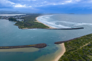 Drone aerial photograph of the South Pacific Ocean and beach at Kurrakwah Bay near the coastal town of Warilla in the Illawarra region on the south coast of NSW, Australia.