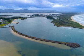 Drone aerial photograph of the South Pacific Ocean and beach at Kurrakwah Bay near the coastal town of Warilla in the Illawarra region on the south coast of NSW, Australia.