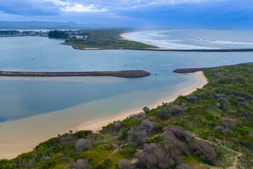 Drone aerial photograph of the South Pacific Ocean and beach at Kurrakwah Bay near the coastal town of Warilla in the Illawarra region on the south coast of NSW, Australia.