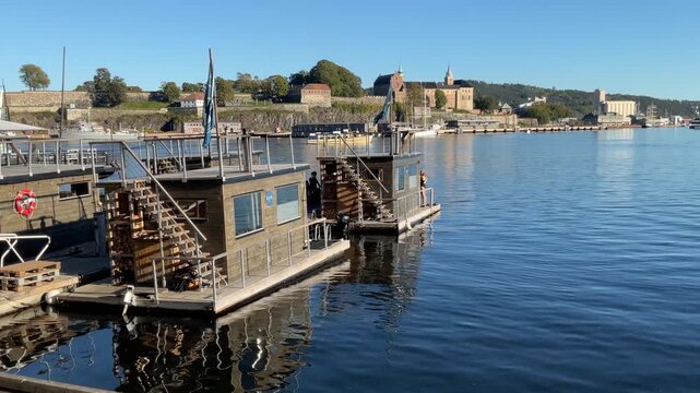 Floating public sauna huts at Aker Brygge in Oslo harbor, Norway