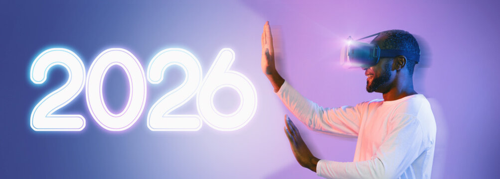A blurred image shows an African American man using a wireless virtual reality headset, immersed in an engaging experience. The vibrant neon background adds to the excitement of modern technology.