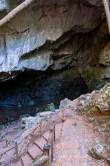 Nimara cave near Marmaris, Turkey inside. Stalactites stalagmites and streak formations in cave of Nimara Magarasi, Turkey. Stone walls and rocks in natural cave. stones covered with moss