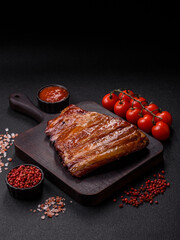 Grilled or barbecued pork or beef ribs with sauce. Cooked or smoked ribs