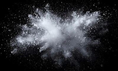 Obraz premium Explosion of white powder or dust against a black background
