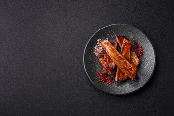 Grilled or barbecued pork or beef ribs with sauce. Cooked or smoked ribs