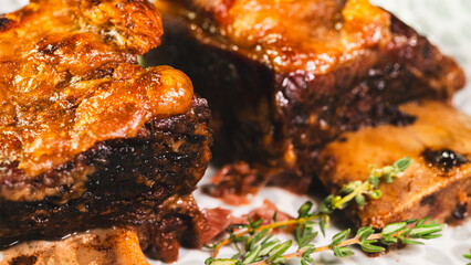 Tender, fall-off-the-bone braised beef short ribs, presented on a plate with fresh thyme. A rich, hearty, and deeply flavorful main course, perfect for comfort food imagery.