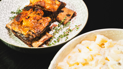 Tender, fall-off-the-bone beef short ribs served with a classic Brazilian potato mayonnaise salad. A hearty and comforting meal that showcases delicious homestyle cooking.