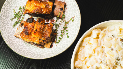 Tender, fall-off-the-bone beef short ribs served with a classic Brazilian potato mayonnaise salad. A hearty and comforting meal that showcases delicious homestyle cooking.