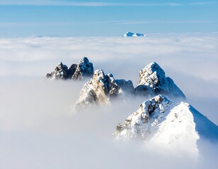 Mountain peaks piercing a sea of clouds