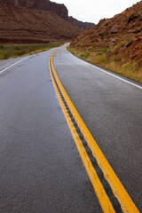 Naklejka premium Scenic two lane road along the Upper Colorado River Scenic Byway near Moab, Uta