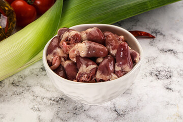 Raw chicken hearts in the bowl