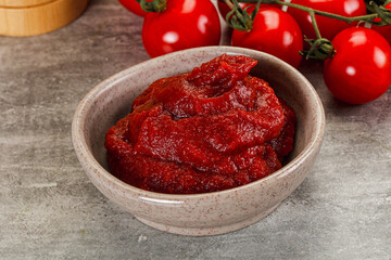 Red tomato paste in the bowl