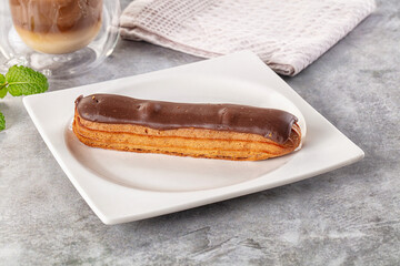 Gourmet chocolate eclair with icing