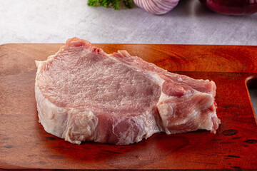 Raw pork steak with bone