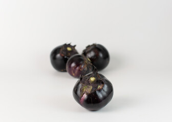 Round eggplant on a white background